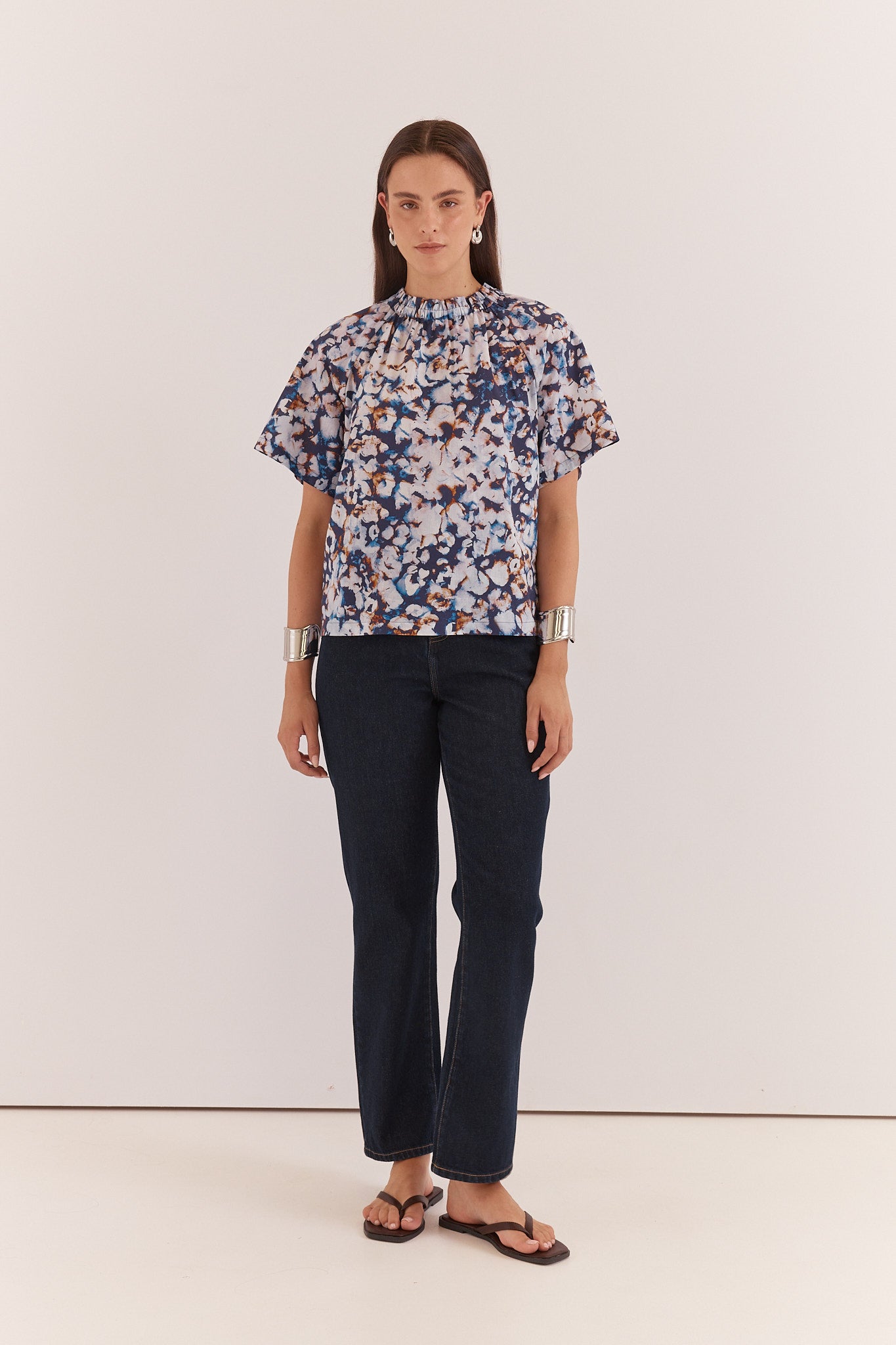 Anika Frill Neck Blouse in blue floral print with gathered frill neckline and flutter sleeves